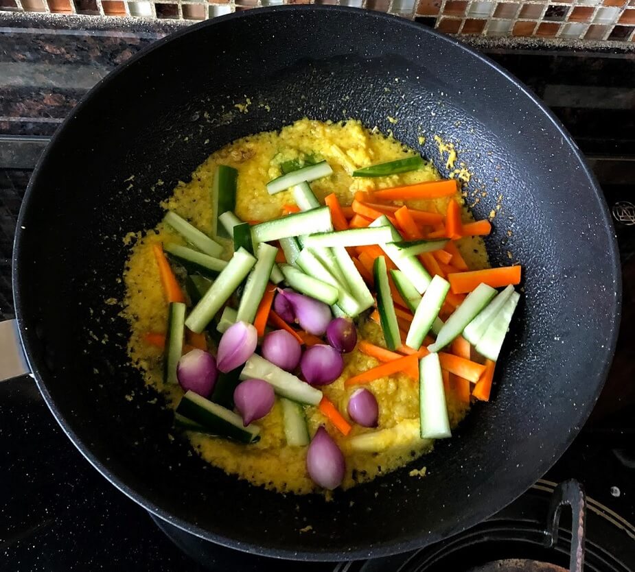 Add the carrot, cucumber and the rest of the shallots